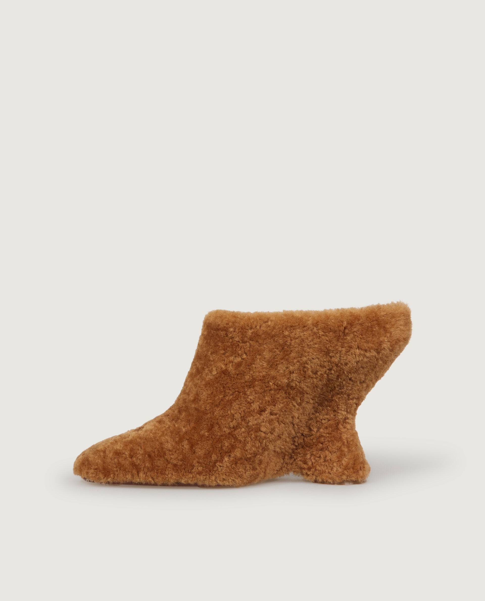 Mules with curved wedge heel