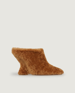 Mules with curved wedge heel