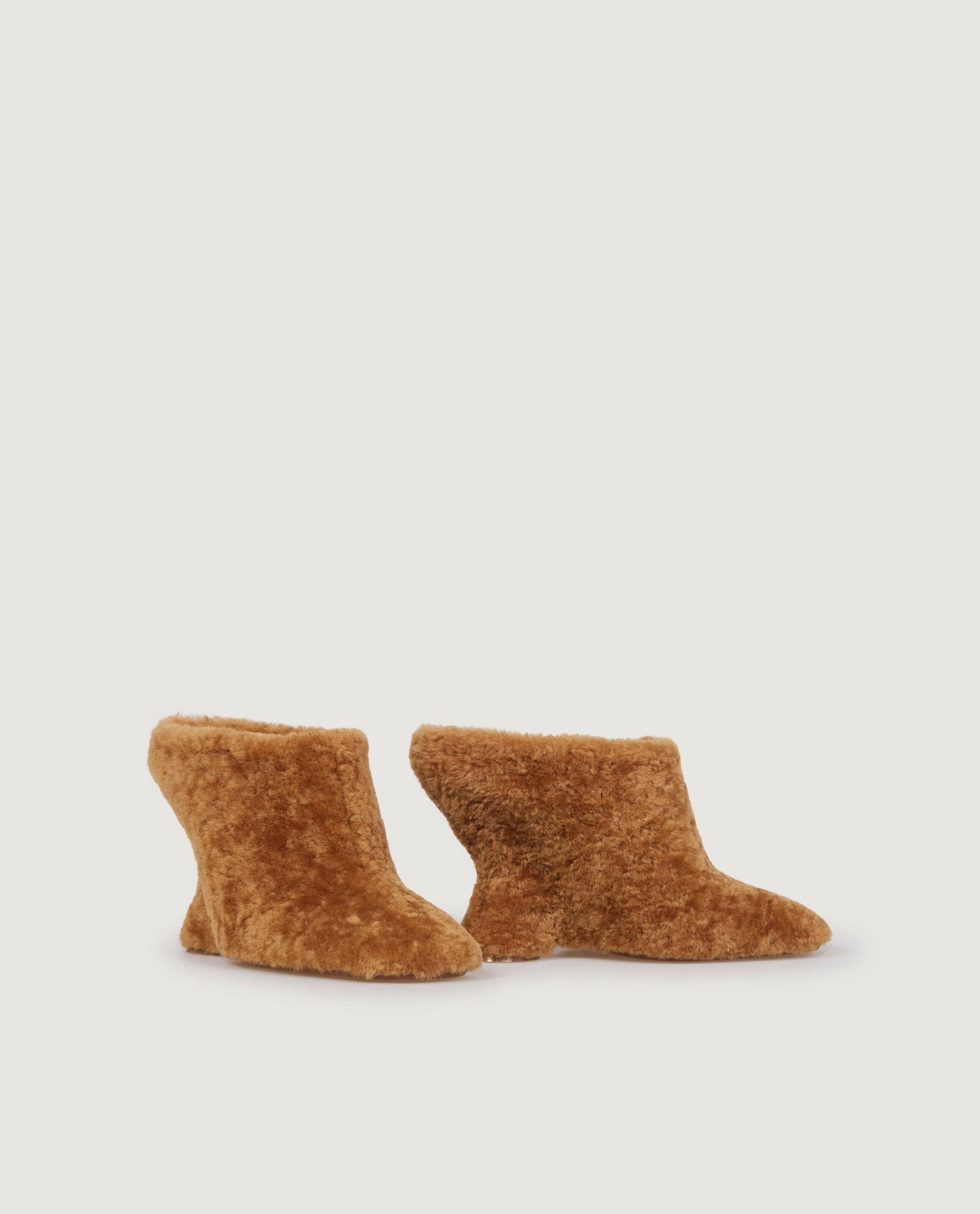 Mules with curved wedge heel