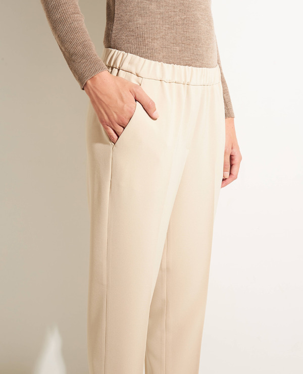 Trousers with pressed creases